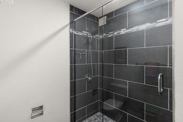 bathroom with a shower stall