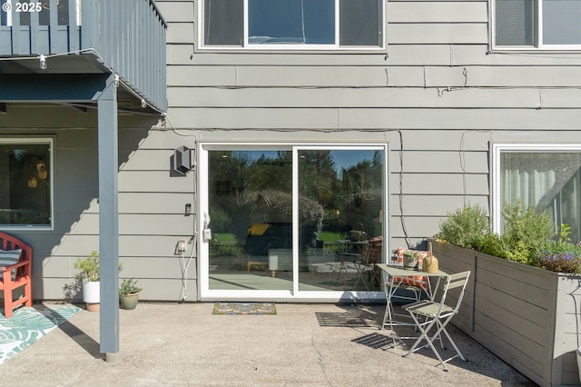 property entrance featuring a patio area