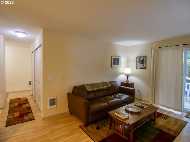 5142 SW Multnomah Blvd Unit A, Portland, OR 97219 - living room with visible vents and light wood-style floors