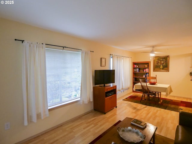 5142 SW Multnomah Blvd Unit A, Portland, OR 97219 - living area with ceiling fan and light wood-style flooring