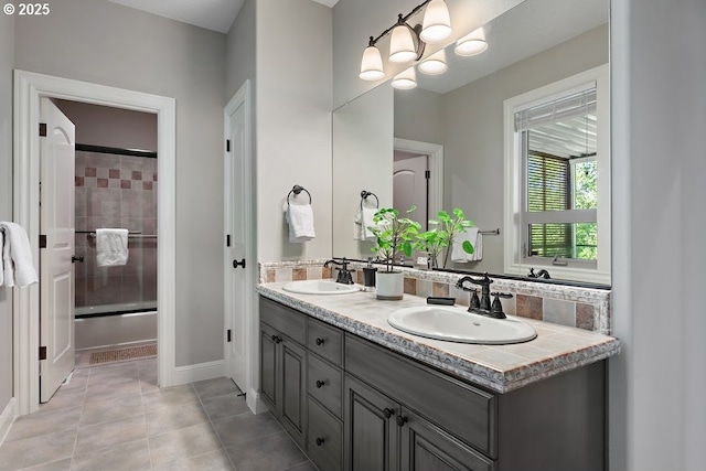 4055 NW Twilight Ter, Portland, OR 97229 - full bath with double vanity, shower / tub combination, tile patterned flooring, and baseboards