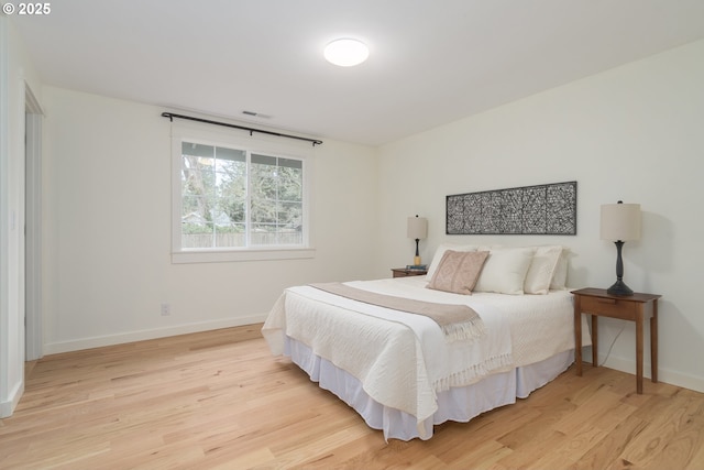 bedroom with light hardwood / wood-style floors