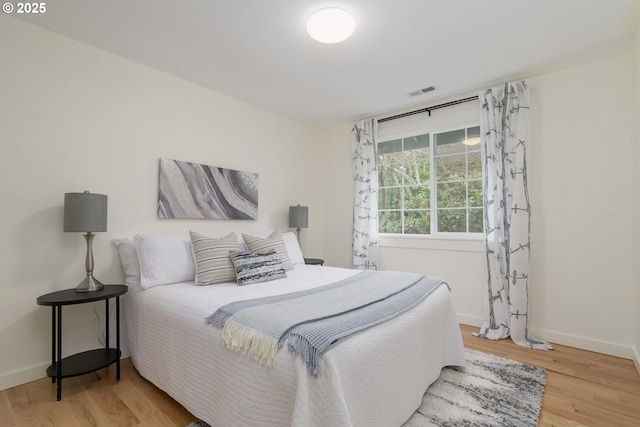 bedroom featuring wood-type flooring