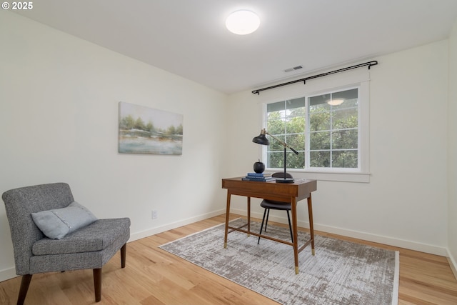 office space with hardwood / wood-style floors