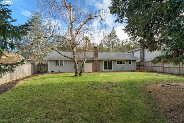 rear view of property with a yard