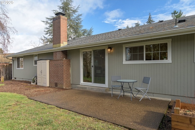 back of house with a patio