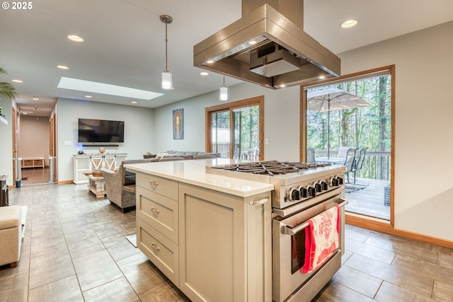 kitchen with high end stove, open floor plan, island exhaust hood, and light countertops