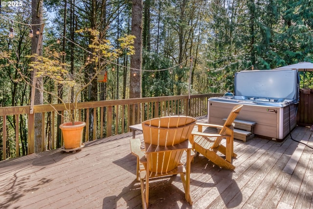 wooden terrace with a hot tub