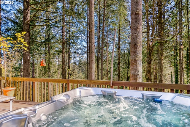 wooden terrace with a hot tub