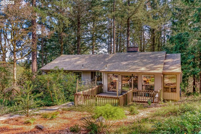 2592 Hillcrest Ct, West Linn, OR 97068 - rear view of property featuring a chimney, roof with shingles, and a deck