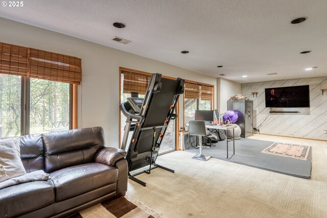 2592 Hillcrest Ct, West Linn, OR 97068 - living room with carpet flooring, recessed lighting, a textured ceiling, and wood walls