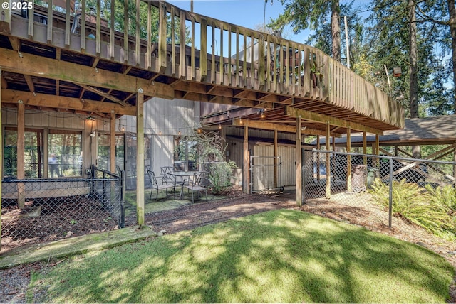 view of yard featuring fence and a carport