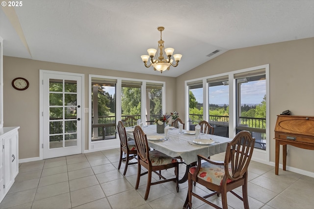 dining area featuring light tile patterned floors, baseboards, visible vents, vaulted ceiling, and a chandelier