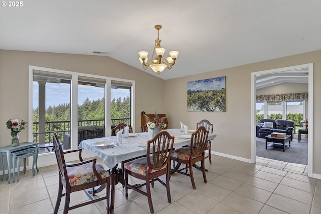 dining space featuring an inviting chandelier, vaulted ceiling, light tile patterned floors, and visible vents