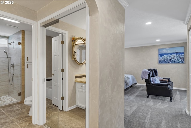 full bathroom featuring vanity, visible vents, a shower stall, crown molding, and toilet