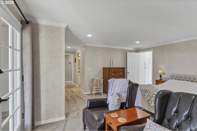 bedroom with light carpet, ornamental molding, recessed lighting, arched walkways, and baseboards