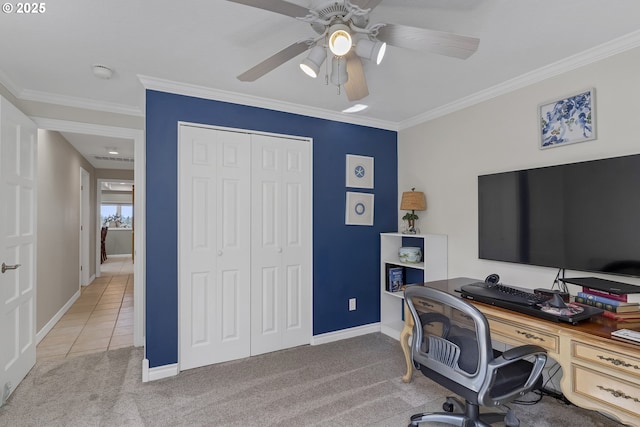 carpeted home office featuring crown molding, baseboards, tile patterned floors, and ceiling fan