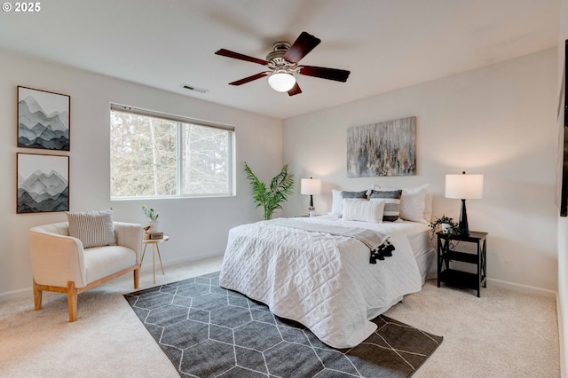 bedroom featuring ceiling fan, visible vents, baseboards, and dark colored carpet