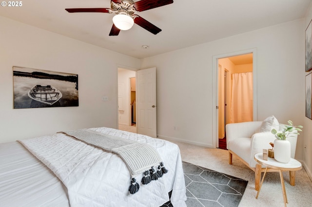 bedroom with carpet, ceiling fan, and baseboards