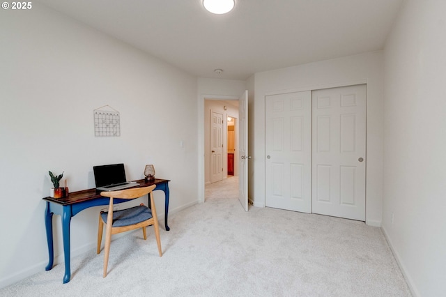 office area featuring light carpet