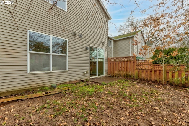 rear view of property with fence