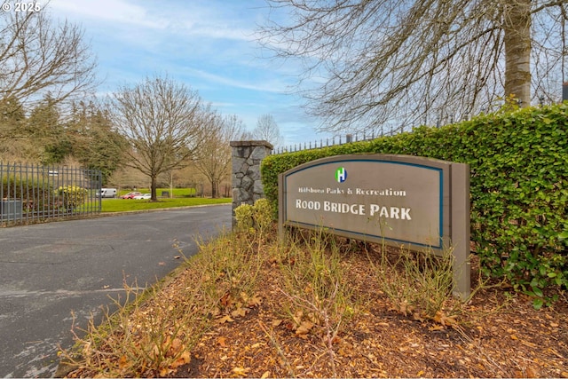 community sign featuring fence