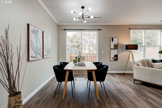 dining space with an inviting chandelier, ornamental molding, dark hardwood / wood-style floors, and a wealth of natural light