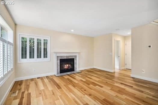 5364 Rosewood St, Lake Oswego, OR 97035 - unfurnished living room featuring wood finished floors, baseboards, a high end fireplace, and recessed lighting