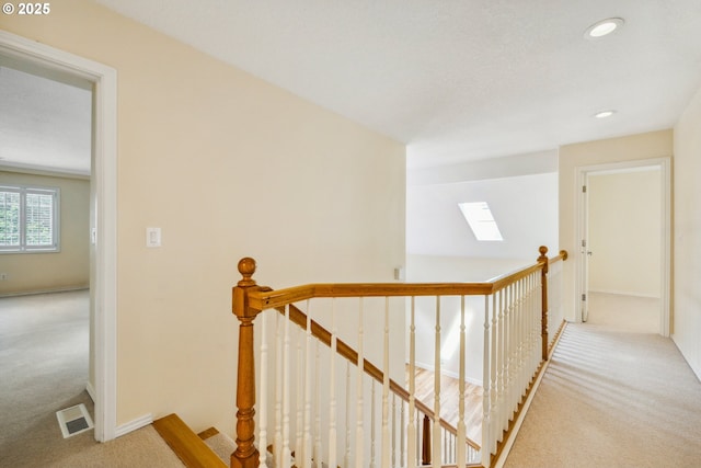 5364 Rosewood St, Lake Oswego, OR 97035 - hall with an upstairs landing, carpet flooring, recessed lighting, baseboards, and a skylight