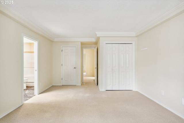 5364 Rosewood St, Lake Oswego, OR 97035 - unfurnished bedroom featuring crown molding, light colored carpet, a closet, baseboards, and connected bathroom