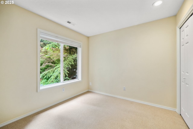 5364 Rosewood St, Lake Oswego, OR 97035 - unfurnished bedroom with light carpet, baseboards, recessed lighting, and a closet