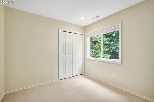 5364 Rosewood St, Lake Oswego, OR 97035 - unfurnished bedroom with baseboards, a closet, and carpet flooring