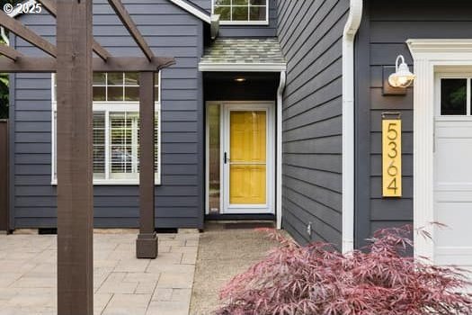 5364 Rosewood St, Lake Oswego, OR 97035 - view of exterior entry featuring a pergola and a patio