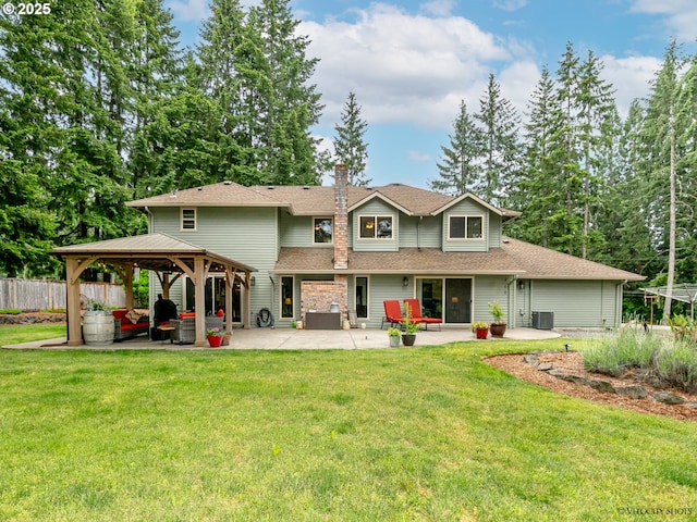 back of house featuring a patio, fence, a gazebo, cooling unit, and a yard