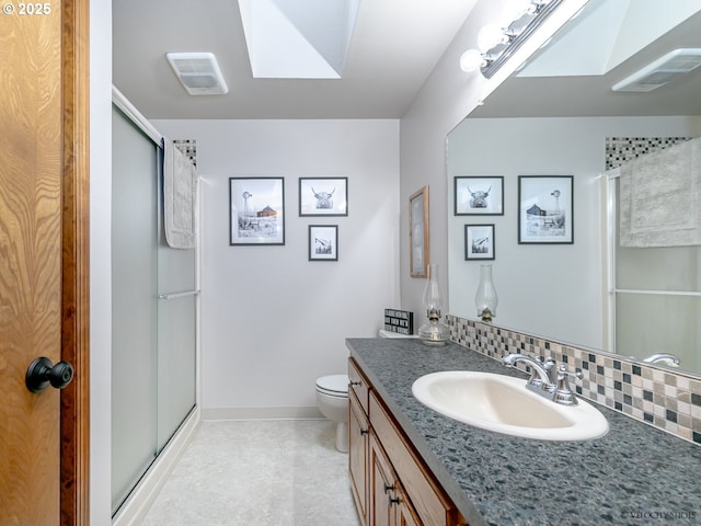 bathroom featuring tasteful backsplash, visible vents, a stall shower, and toilet