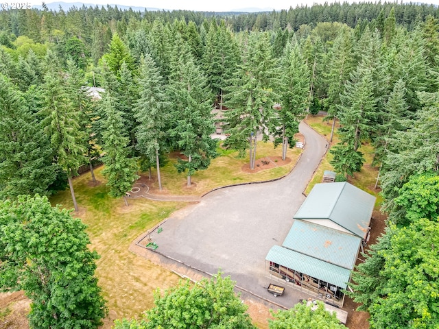 birds eye view of property with a forest view