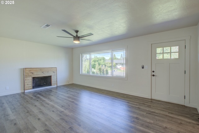 355 W Berdine St, Roseburg, OR 97471 - unfurnished living room with healthy amount of natural light, a ceiling fan, wood finished floors, and baseboards