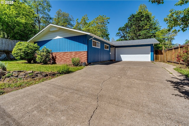 2220 Hayes St, Eugene, OR 97405 - view of front of house with brick siding, driveway, and a garage