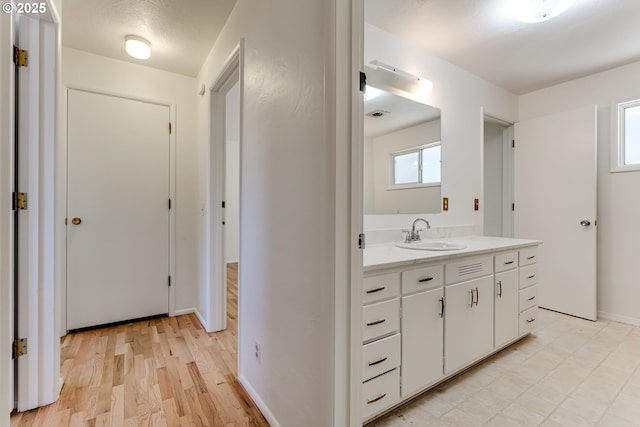 2220 Hayes St, Eugene, OR 97405 - bathroom featuring vanity, wood finished floors, and baseboards