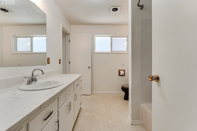 2220 Hayes St, Eugene, OR 97405 - full bath featuring vanity, a bath, baseboards, and toilet