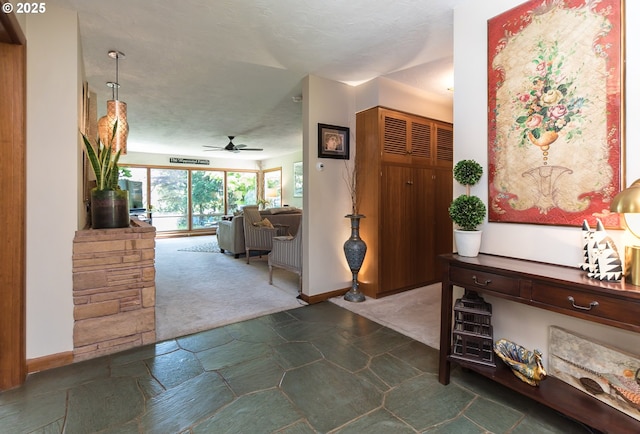 5339 SE Chase Rd, Gresham, OR 97080 - hallway featuring stone finish floors and baseboards