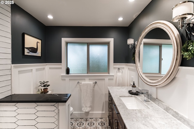5339 SE Chase Rd, Gresham, OR 97080 - bathroom featuring vanity, a wainscoted wall, a decorative wall, and recessed lighting