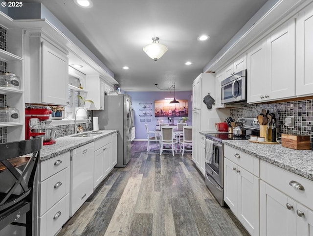 kitchen with white cabinetry and appliances with stainless steel finishes