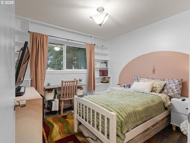 bedroom featuring a textured ceiling