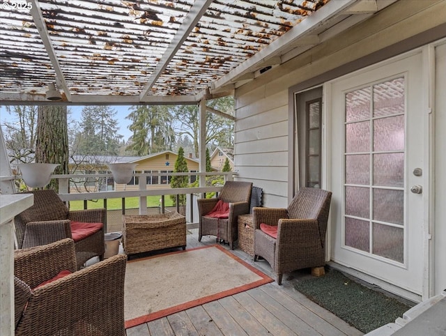 deck featuring an outdoor living space and a pergola