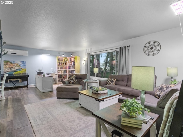 living room featuring hardwood / wood-style floors and a textured ceiling