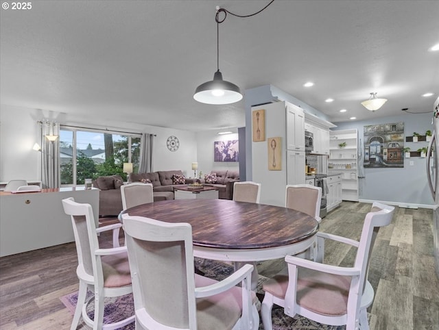 dining space featuring light wood-type flooring