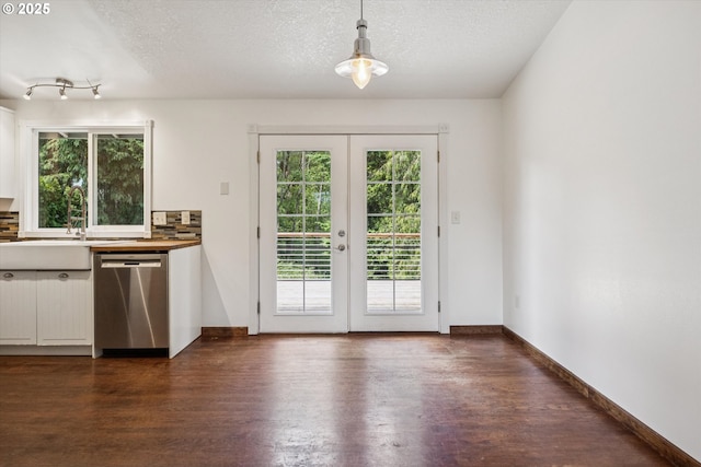 1625 SE Regner Rd, Gresham, OR 97080 - kitchen featuring dishwasher, dark wood finished floors, french doors, white cabinetry, and decorative light fixtures