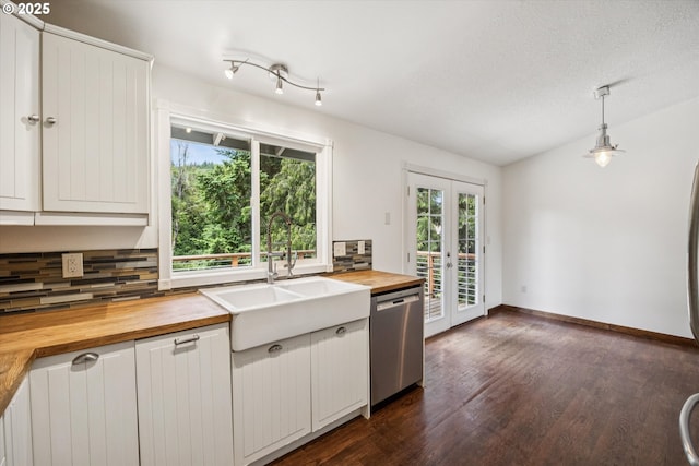 1625 SE Regner Rd, Gresham, OR 97080 - kitchen with wooden counters, stainless steel dishwasher, tasteful backsplash, french doors, and dark wood-style flooring