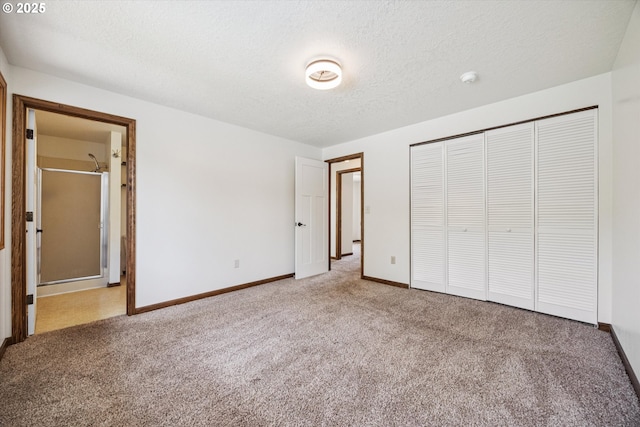 1625 SE Regner Rd, Gresham, OR 97080 - unfurnished bedroom with carpet floors, a closet, a textured ceiling, and ensuite bathroom